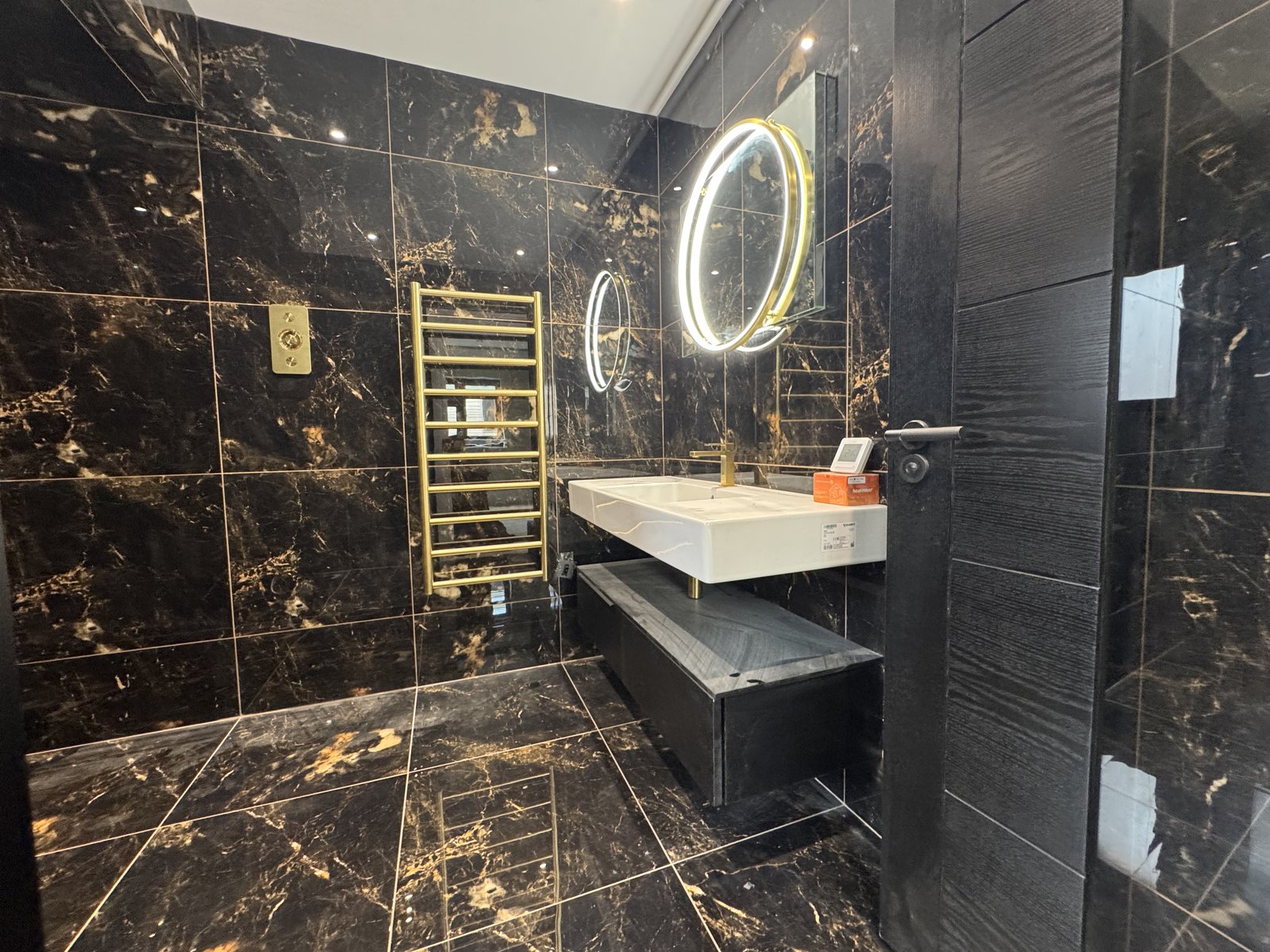 Black and gold marble bathroom